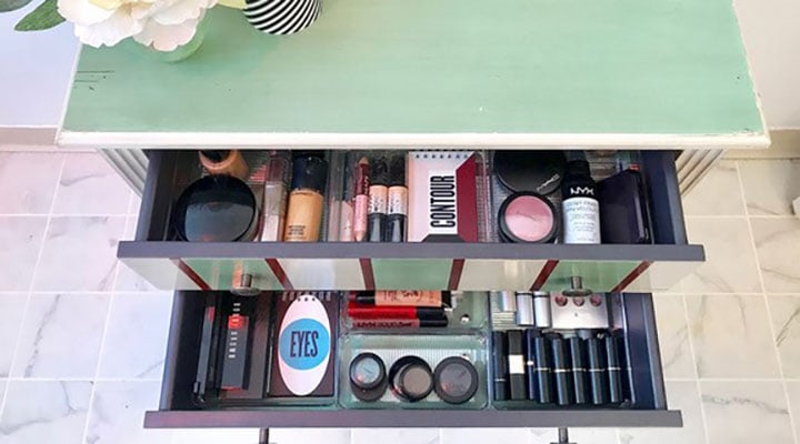 view of open drawer with organized makeup bins